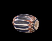 Chevron Bead, cased, drawn, ground. Italy, Venice, about 17th–18th centuries. 5 cm x 4.5 cm. Collection of The Corning Museum of Glass, 66.3.10A.