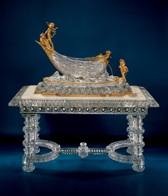 Fig. 4: Cut glass sculpture in the form of a boat mounted on a glass table with a marble top, pressed, cut; assembled on metal frame. Boat designed by Charles Vital Cornu and created by Baccarat in 1900; table designed (with glass top) by Baccarat in 1889. OH. 167 cm. The Corning Museum of Glass, Corning, New York (79.3.155).